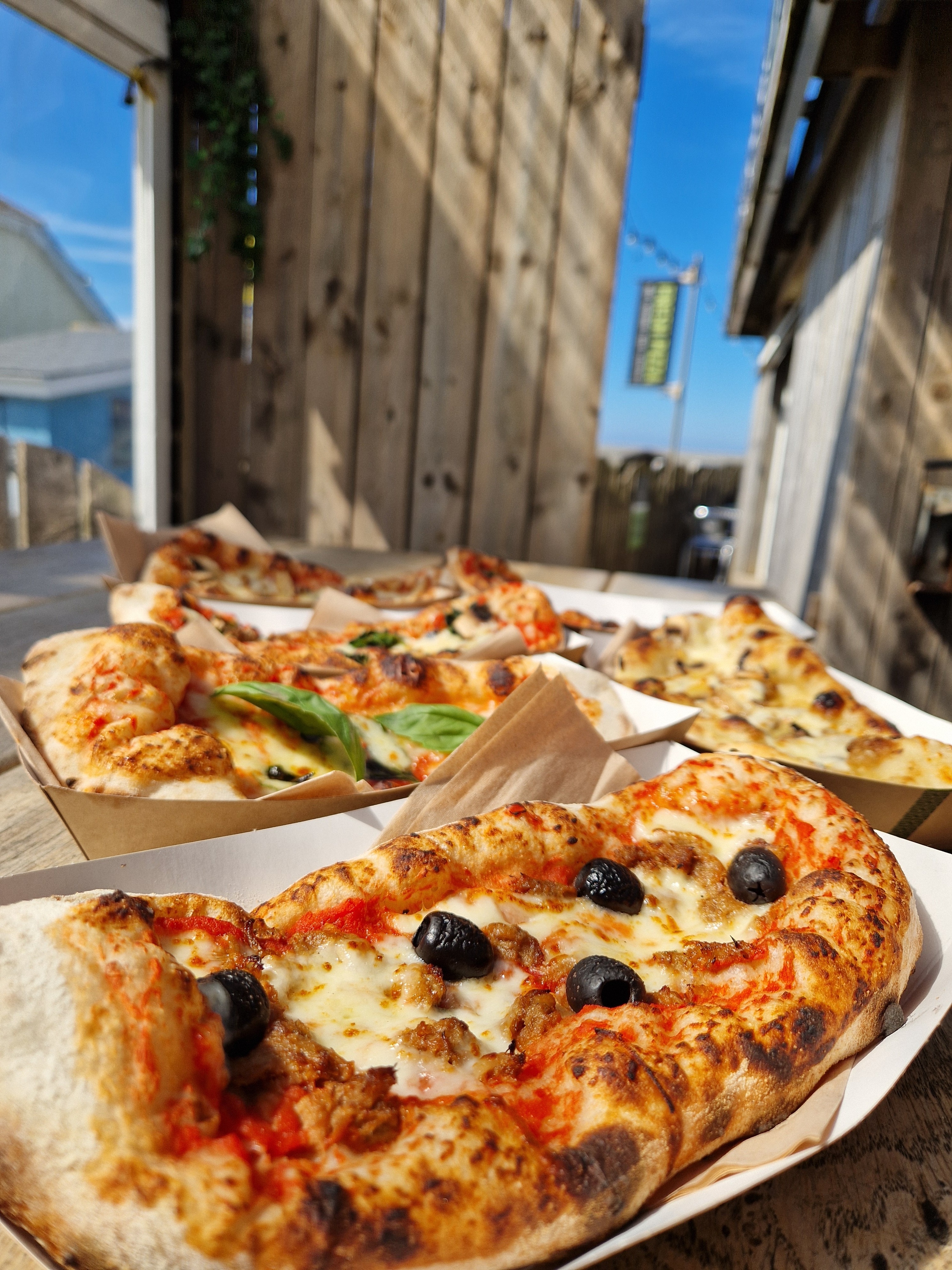 Pig and Olive Pizzetta with olives and cheese